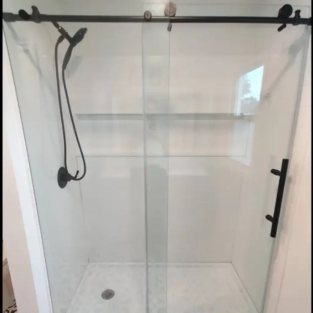 Modern glass shower with black fixtures