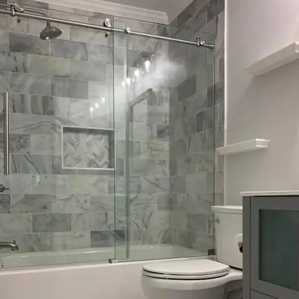 A stylish bathroom interior with a glass shower door and a toilet, emphasizing contemporary decor and functionality.